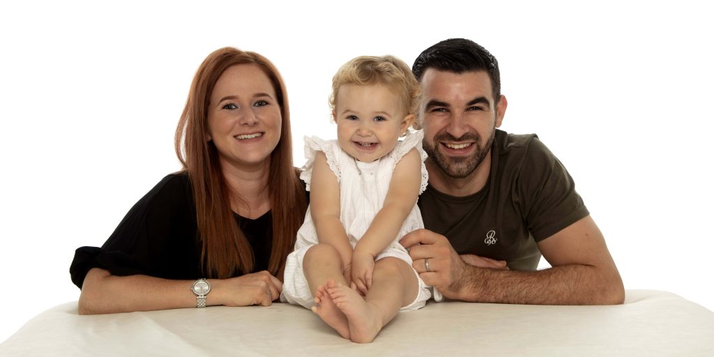 Candid family moment during a studio photography session in Leicester